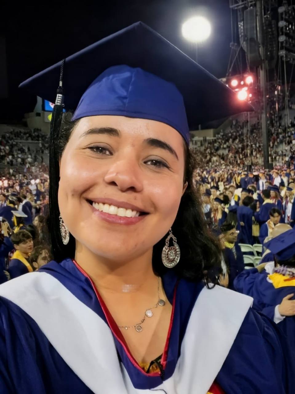 Warda smiling at a graduation ceremony